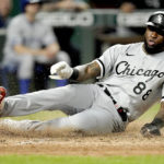 
              Chicago White Sox's Luis Robert slides home to score on a double by Gavin Sheets during the eighth inning of the second game of a baseball doubleheader against the Kansas City Royals Tuesday, Aug. 9, 2022, in Kansas City, Mo. (AP Photo/Charlie Riedel)
            