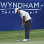 
              Joohyoung Kim, right, of South Korea, putts on the 18th hole during the final round of the Wyndham Championship golf tournament in Greensboro, N.C., Sunday, Aug. 7, 2022. (AP Photo/Chuck Burton)
            