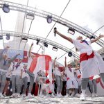 
              England players celebrate on stage at an event at Trafalgar Square in London, Monday, Aug. 1, 2022. England beat Germany 2-1 and won the final of the Women's Euro 2022 on Sunday.  (James Manning/PA via AP)
            