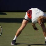 
              Andrey Rublev, of Russia, throws down his racket during a match against Laslo Djere, of Serbia, during the first round of the US Open tennis championships, Tuesday, Aug. 30, 2022, in New York. (AP Photo/Charles Krupa)
            
