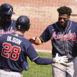 
              Atlanta Braves' Ronald Acuna Jr., right, is greeted by teammates Matt Olson (28) and Michael Harris II after score from first on a bases-loaded double by Dansby Swanson during the fourth inning of a baseball game against the Pittsburgh Pirates, Wednesday, Aug. 24, 2022, in Pittsburgh. (AP Photo/Keith Srakocic)
            
