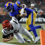 
              Los Angeles Rams cornerback Grant Haley (36) tackles Cincinnati Bengals quarterback Jake Browning (6) during the second half of a preseason NFL football game in Cincinnati, Saturday, Aug. 27, 2022. (AP Photo/Joshua A. Bickel)
            