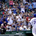 
              Chicago Cubs starting pitcher Javier Assad receives a standing ovation from the Wrigley Field crowd as he is pulled in the fifth inning of a baseball game and his Major League debut, against the St. Louis Cardinals Tuesday, Aug. 23, 2022, in Chicago. (AP Photo/Charles Rex Arbogast)
            