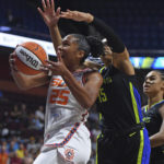 
              Connecticut Sun forward Alyssa Thomas (25) drives to the basket as Dallas Wings guard Allisha Gray (15) defends during Game 1 of a WNBA basketball first-round playoff series Thursday, Aug. 18, 2022, in Uncasville, Conn. (Sean D. Elliot/The Day via AP)
            