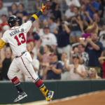 
              Atlanta Braves Ronald Acuna Jr. gestures after hitting a solo home run in the fifth inning of a baseball game against the Colorado Rockies Wednesday, Aug. 31, 2022, in Atlanta. (AP Photo/Hakim Wright Sr.)
            