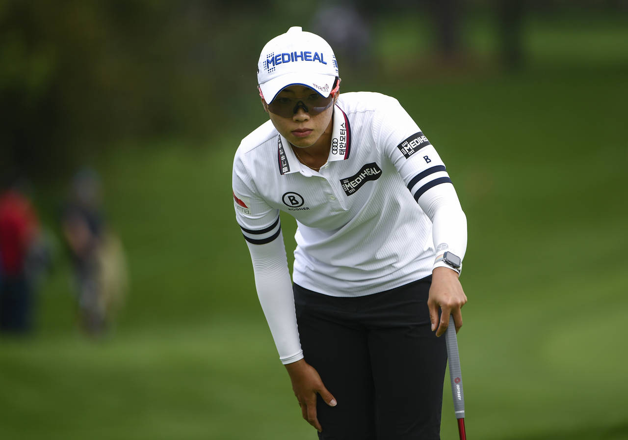 Na Rin An, of South Korea, prepares for a putt on the green of the 18th hole during the second roun...