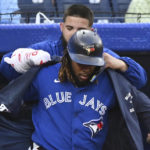 
              Toronto Blue Jays first baseman Vladimir Guerrero Jr., front, has the home run jacket put on him by Alek Manoah after his two-run home run against the Baltimore Orioles during the first inning of a baseball game Tuesday, Aug. 16, 2022, in Toronto. (Jon Blacker/The Canadian Press via AP)
            