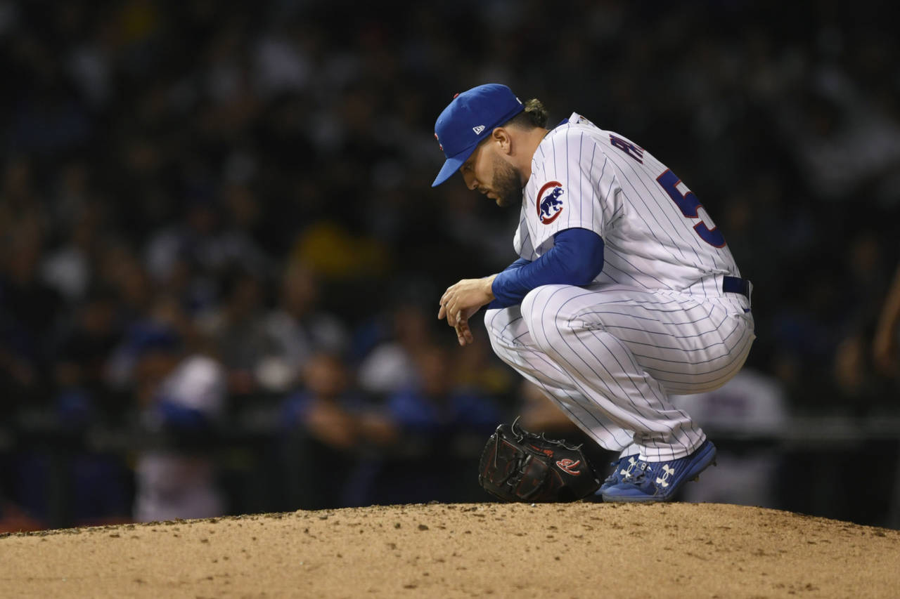 Chicago Cubs relief pitcher Nicholas Padilla pauses on the mound before pitching in his major leagu...