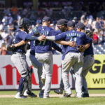 
              The Seattle Mariners do a dance to celebrate defeating the New York Yankees in a baseball game, Wednesday, Aug. 3, 2022, in New York. (AP Photo/Mary Altaffer)
            