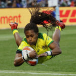 
              FILE - Australia's Ellia Green dives to score against the United States during the Women's Rugby Sevens World Cup final in San Francisco, Saturday, July 21, 2018. Green, one of the stars of Australia's gold medal-winning women's rugby sevens team at the 2016 Olympics, has transitioned to male. The 29-year-old, Fiji-born Green is going public in a video at an international summit aimed at ending transphobia and homophobia in sport. The summit is being hosted in Ottawa as part of the Bingham Cup rugby tournament. (AP Photo/Jeff Chiu, File)
            