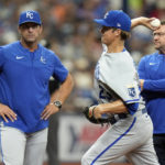 
              Kansas City Royals manager Mike Matheny, left, watches as starting pitcher Zack Greinke throws a warm up pitch after feeling discomfort in his wrist during the fourth inning of a baseball game against the Tampa Bay Rays Sunday, Aug. 21, 2022, in St. Petersburg, Fla. Greinke stayed on the game. (AP Photo/Chris O'Meara)
            