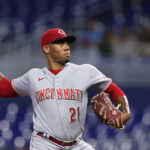 
              Cincinnati Reds' Hunter Greene delivers a pitch during the first inning of a baseball game against the Miami Marlins, Monday, Aug. 1, 2022, in Miami. (AP Photo/Wilfredo Lee)
            