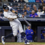 
              New York Yankees' Aaron Judge hits a home run in the third inning of a baseball game against the New York Mets, Monday, Aug. 22, 2022, in New York. (AP Photo/Corey Sipkin)
            