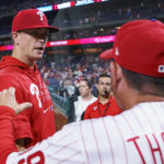 
              Philadelphia Phillies' Kyle Gibson, left, is congratulated by manager Rob Thomson, right, following the ninth inning of a baseball game against the Washington Nationals, Friday, Aug. 5, 2022, in Philadelphia. (AP Photo/Chris Szagola)
            