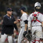 
              Cleveland Guardians starting pitcher Aaron Civale, center, is relieved by manager Terry Francona, left, in the fifth inning a baseball game against the San Diego Padres, Tuesday, Aug. 23, 2022, in San Diego. (AP Photo/Derrick Tuskan)
            