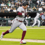 
              Arizona Diamondbacks' Josh Rojas runs after hitting a three-run double against the Chicago White Sox during the second inning of a baseball game in Chicago, Friday, Aug. 26, 2022. (AP Photo/Nam Y. Huh)
            
