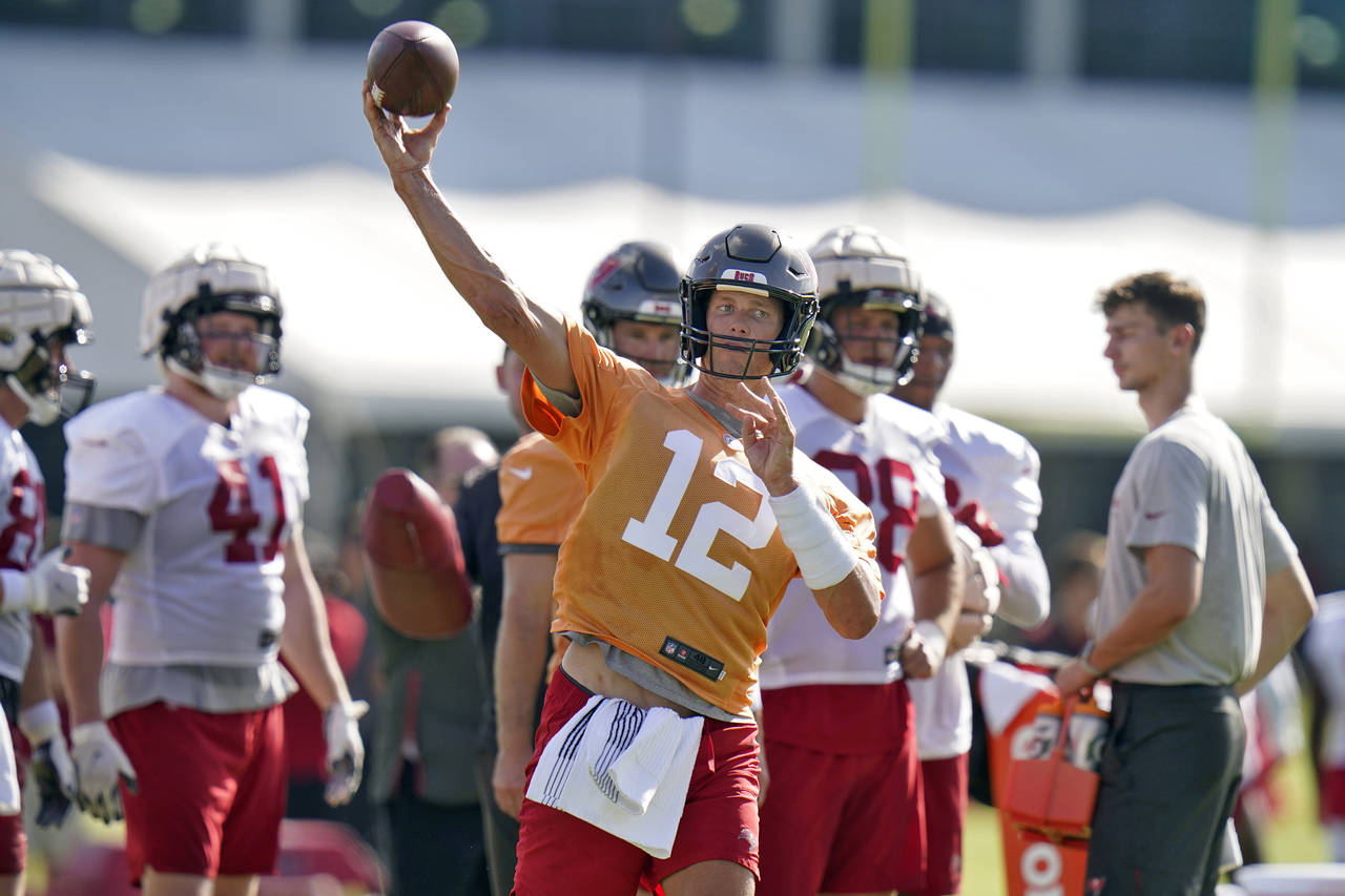Tampa Bay Buccaneers quarterback Tom Brady throws a pass during an NFL football training camp pract...