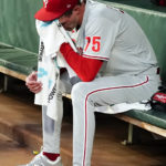 
              Philadelphia Phillies relief pitcher Connor Brogdon (75) sits on the bench after the Phillies allowed two run in the third inning of a baseball game against the Atlanta Braves Tuesday, Aug. 2, 2022, in Atlanta. (AP Photo/John Bazemore)
            