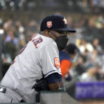 
              Houston Astros manager Dusty Baker Jr. wears a protective mask as he watches from the dugout during the fifth inning of the team's baseball game against the Chicago White Sox on Monday, Aug. 15, 2022, in Chicago. (AP Photo/Charles Rex Arbogast)
            