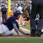 
              Tampa Bay Rays second baseman Brandon Lowe is tagged out at home by Detroit Tigers catcher Eric Haase during the fifth inning of a baseball game, Saturday, Aug. 6, 2022, in Detroit. (AP Photo/Carlos Osorio)
            