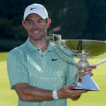 
              Rory McIlroy, of Northern Ireland, holds the championchip trophy after winning the final round of the Tour Championship golf tournament at East Lake Golf Club, Sunday, Aug. 28, 2022, in Atlanta. (AP Photo/Steve Helber)
            