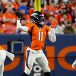 
              Denver Broncos quarterback Josh Johnson (11) throws against the Dallas Cowboys during the first half of an NFL preseason football game, Saturday, Aug. 13, 2022, in Denver. (AP Photo/Jack Dempsey)
            
