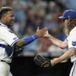 
              Kansas City Royals' Salvador Perez and relief pitcher Scott Barlow celebrate after their baseball game against the Boston Red Sox Thursday, Aug. 4, 2022, in Kansas City, Mo. The Royals won 7-3. (AP Photo/Charlie Riedel)
            
