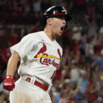 
              St. Louis Cardinals' Tommy Edman celebrates after hitting a solo home run during the eighth inning of a baseball game against the Atlanta Braves Sunday, Aug. 28, 2022, in St. Louis. (AP Photo/Jeff Roberson)
            