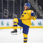 
              Sweden's Emil Andrae (4) celebrates a goal against Latvia during the third period in the quarterfinals of the world junior hockey championship in Edmonton, Alberta, Wednesday, Aug. 17, 2022 (Jason Franson/The Canadian Press via AP)
            