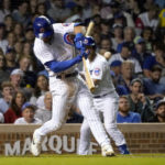 
              Chicago Cubs' Nico Hoerner hits an RBI single off Washington Nationals relief pitcher Kyle Finnegan during the seventh inning of a baseball game Tuesday, Aug. 9, 2022, in Chicago. (AP Photo/Charles Rex Arbogast)
            