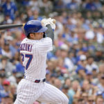 
              Chicago Cubs' Seiya Suzuki singles against the Miami Marlins during the first inning of a baseball game, Sunday, Aug. 7, 2022, at Wrigley Field in Chicago. (AP Photo/Mark Black)
            