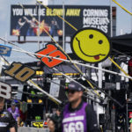 
              Crews hang signs at their pit stops before a NASCAR Cup Series auto race in Watkins Glen, N.Y., Sunday, Aug. 21, 2022. (AP Photo/Seth Wenig)
            