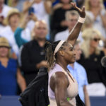 
              Serena Williams, of the United States, waves to the crowd after losing 6-4, 6-0 to Emma Raducanu, of Britain, during the Western & Southern Open tennis tournament Tuesday, Aug. 16, 2022, in Mason, Ohio. (AP Photo/Aaron Doster)
            
