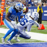 
              Indianapolis Colts wide receiver Samson Nacua (86) makes a catch for a touchdown over Detroit Lions cornerback Cedric Boswell (35) during the second half of an NFL preseason football game in Indianapolis, Saturday, Aug. 20, 2022. (AP Photo/AJ Mast)
            