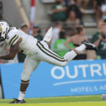
              Vanderbilt running back Re'Mahn Davis (2) gets past Hawaii defensive back Leonard Lee, right, for a touchdown during the second half of an NCAA college football game, Saturday, Aug. 27, 2022, in Honolulu. (AP Photo/Marco Garcia)
            