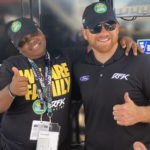 
              James Bromsey III, left, a sixth-grader at LeBron James' I Promise School in Akron, Ohio, poses with NASCAR driver Chris Buescher, Sunday, Aug. 7, 2022 in Brooklyn, Mich. Bromsey was given an all-access tour of Michigan International Speedway in Brooklyn, Mich., on Sunday. Chris Buescher’s No. 17 Ford had a paint job that highlighted the LeBron James Family Foundation. (AP Photo/Larry Lage)
            