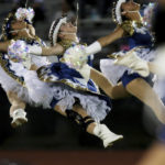 
              The Edinburg North high school dance team the Golden Spurs and the Edinburg Vela High Sapphires perform during a halftime show at Richard R. Flores Stadium, Friday, Aug. 27, 2022, in Edinburg, Texas. (Delcia Lopez/The Monitor via AP)
            