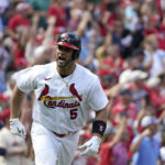 
              St. Louis Cardinals' Albert Pujols celebrates after hitting a three-run home run during the eighth inning of a baseball game against the Milwaukee Brewers Sunday, Aug. 14, 2022, in St. Louis. (AP Photo/Jeff Roberson)
            