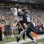 
              Seattle Seahawks cornerback Coby Bryant, right, breaks up a pass intended for Chicago Bears wide receiver Isaiah Coulter, left, during the second half of a preseason NFL football game, Thursday, Aug. 18, 2022, in Seattle. (AP Photo/Stephen Brashear)
            