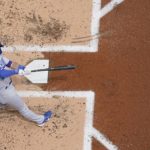 
              Los Angeles Dodgers' Gavin Lux hits a single during the second inning of a baseball game against the Milwaukee Brewers Thursday, Aug. 18, 2022, in Milwaukee. (AP Photo/Morry Gash)
            