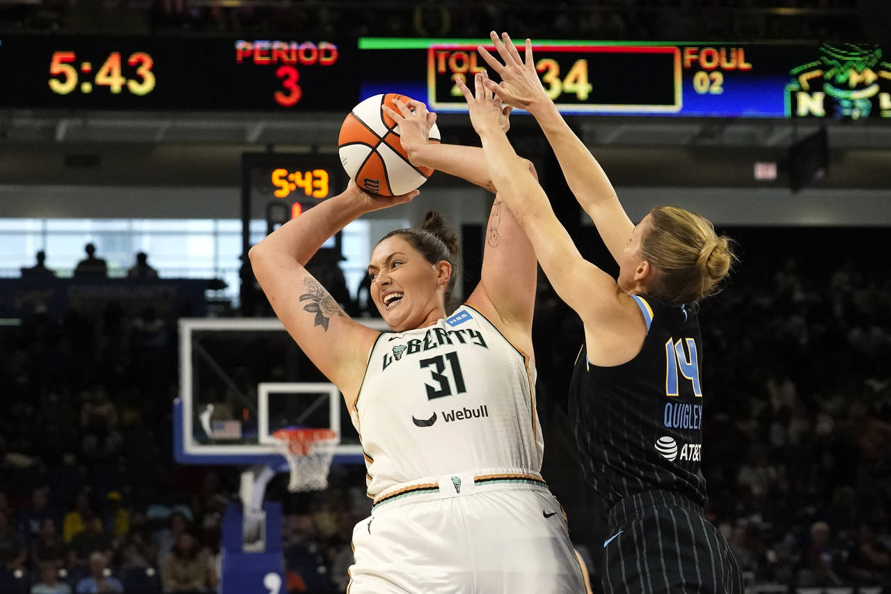 Chicago Sky's Allie Quigley (14) pressures New York Liberty's Stefanie Dolson during the second hal...