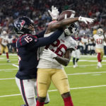 
              San Francisco 49ers cornerback Samuel Womack III (26) breaks up a pass intended for Houston Texans wide receiver Chris Moore (15) during the first half of an NFL football game Thursday, Aug. 25, 2022, in Houston. The ball was intercepted by San Francisco 49ers safety Tarvarius Moore. (AP Photo/David J. Phillip)
            