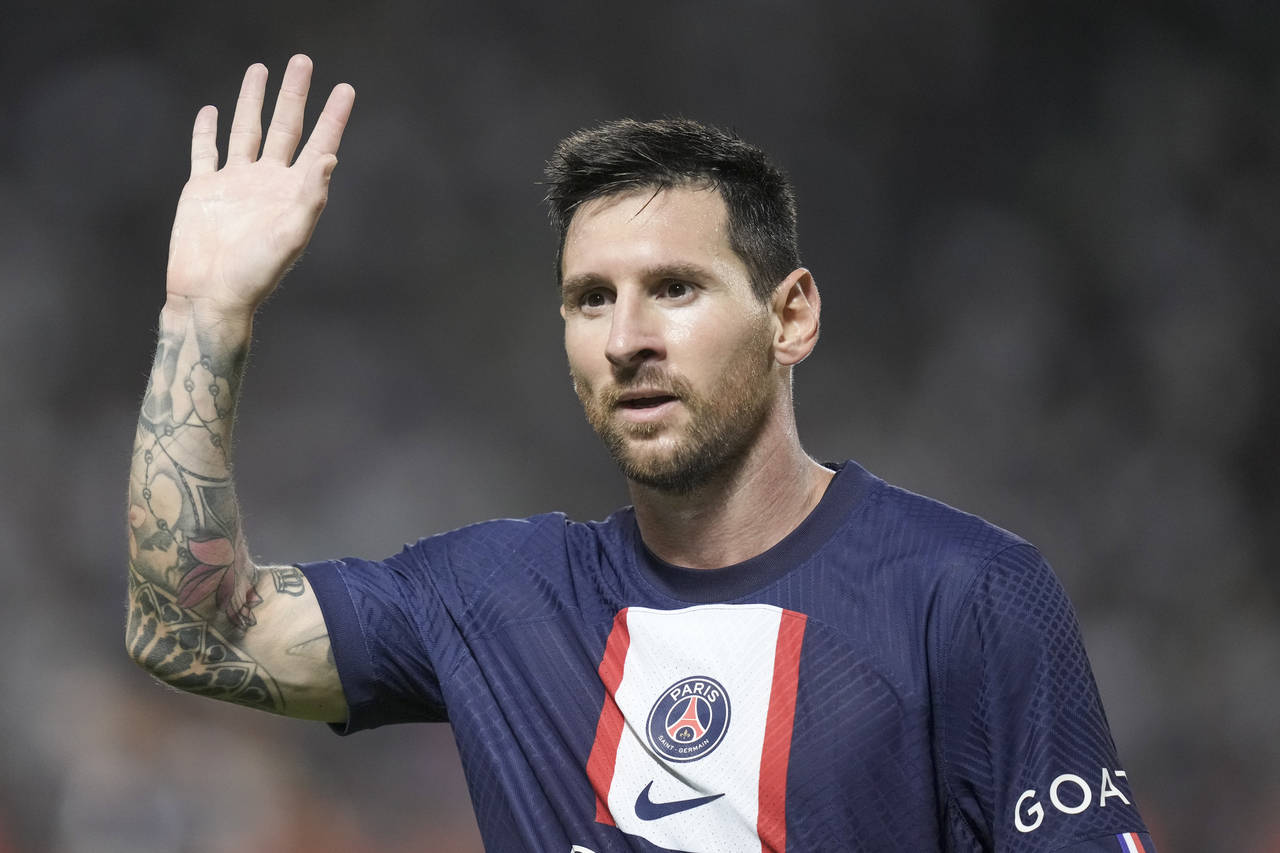 PSG's Lionel Messi waves during the French Super Cup final soccer match between Nantes and Paris Sa...