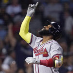 
              Atlanta Braves' Marcell Ozuna points upwards while crossing home plate on his three-run home run off Boston Red Sox starting pitcher Nick Pivetta during the fourth inning of a baseball game Wednesday, Aug. 10, 2022, in Boston. (AP Photo/Charles Krupa)
            