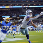 
              Dallas Cowboys wide receiver Simi Fehoko, right, reaches but cannot make a catch in the end zone in front of Los Angeles Chargers cornerback Deane Leonard (33) during the first half of a preseason NFL football game Saturday, Aug. 20, 2022, in Inglewood, Calif. (AP Photo/Ashley Landis)
            