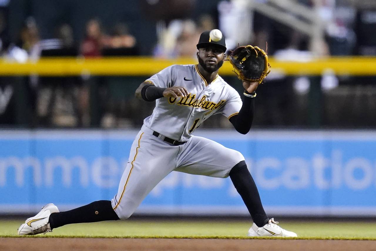 Pittsburgh Pirates second baseman Rodolfo Castro slides over to make a catch on a liner hit by Ariz...