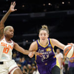 
              Los Angeles Sparks forward Katie Lou Samuelson, right drives pas Connecticut Sun guard Courtney Williams during the first half of a WNBA basketball game Thursday, Aug. 11, 2022, in Los Angeles. (AP Photo/Mark J. Terrill)
            