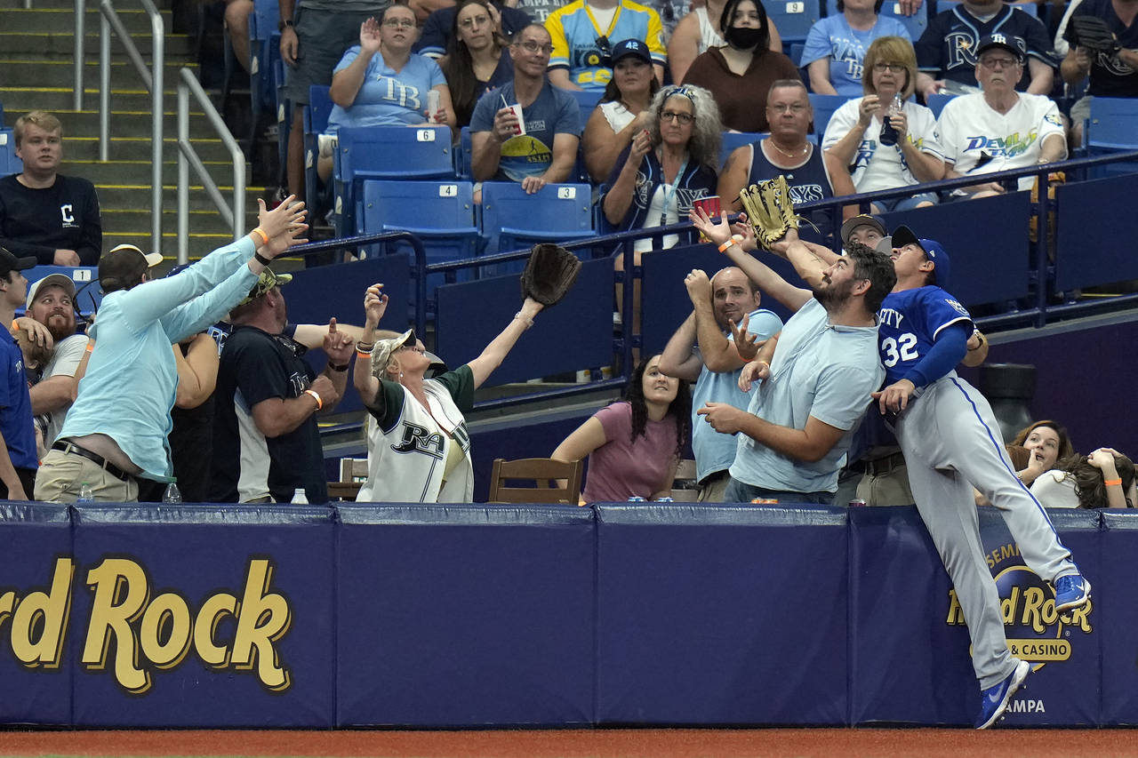 Kansas City Royals let fielder Nick Pratto (32) goes into the crowd chasing a foul ball by Tampa Ba...