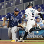 
              Miami Marlins' Jon Berti (5) beats the throw to Tampa Bay Rays first baseman Harold Ramirez for a single during the fourth inning of a baseball game Wednesday, Aug. 31, 2022, in Miami. (AP Photo/Lynne Sladky)
            