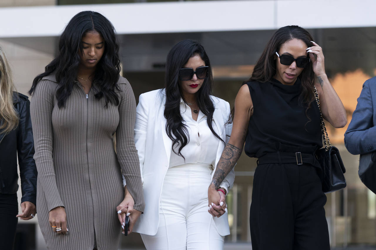 Vanessa Bryant, center, Kobe Bryant's widow, leaves a federal courthouse with her daughter, Natalia...